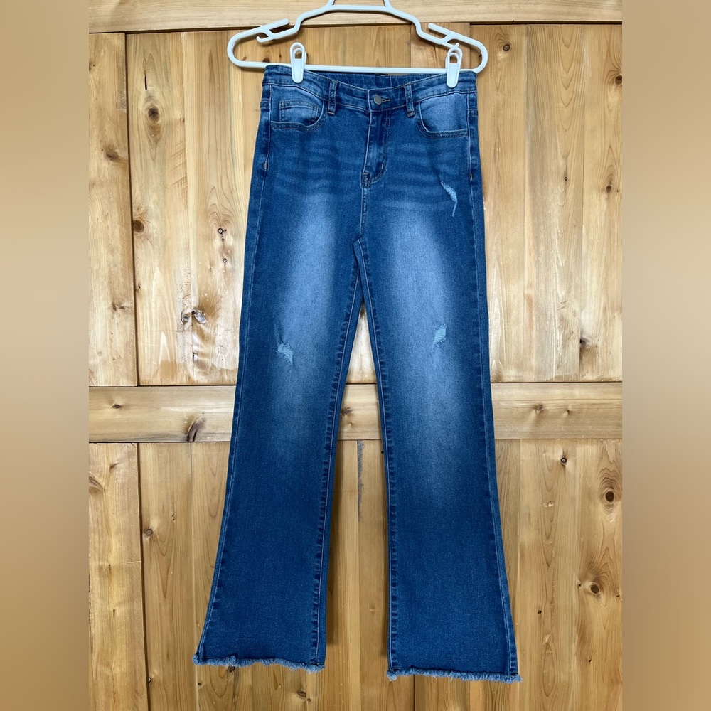 Girls jeans size 11/12 but fits a petite lady as a 2. Distressed and stretchy.